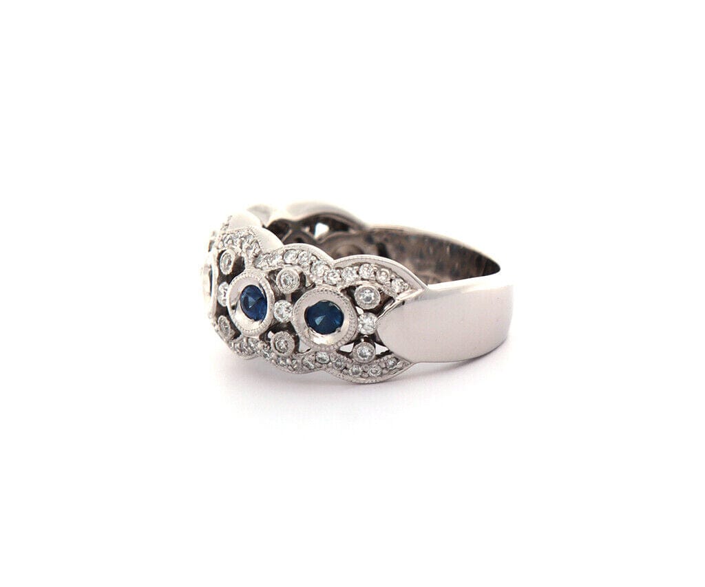 0.32ctw Bezel Set Sapphire and 0.50ctw Diamond Wave Band Ring in 18K