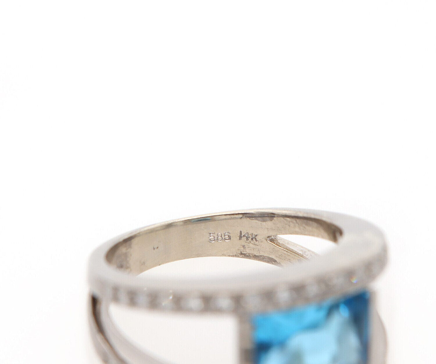 0.25ctw Diamond and Blue Topaz Bezel Set Ring in 14K