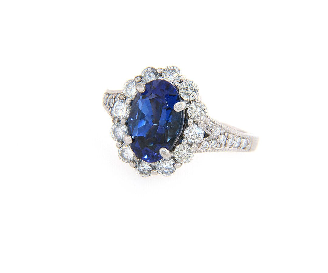 2.71ct Oval Tanzanite and 1.12ctw Diamond Frame Ring in 14K