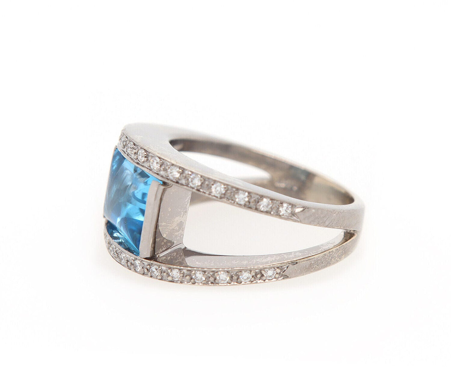 0.25ctw Diamond and Blue Topaz Bezel Set Ring in 14K