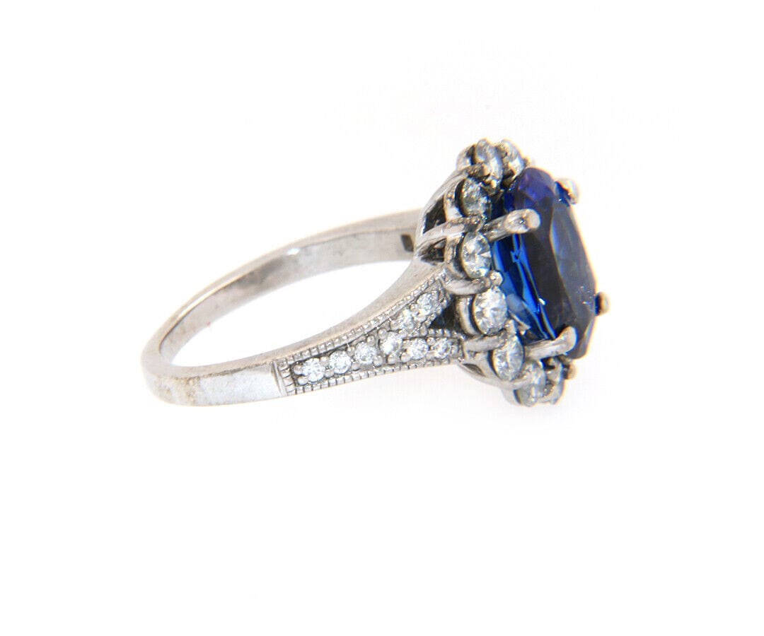 2.71ct Oval Tanzanite and 1.12ctw Diamond Frame Ring in 14K