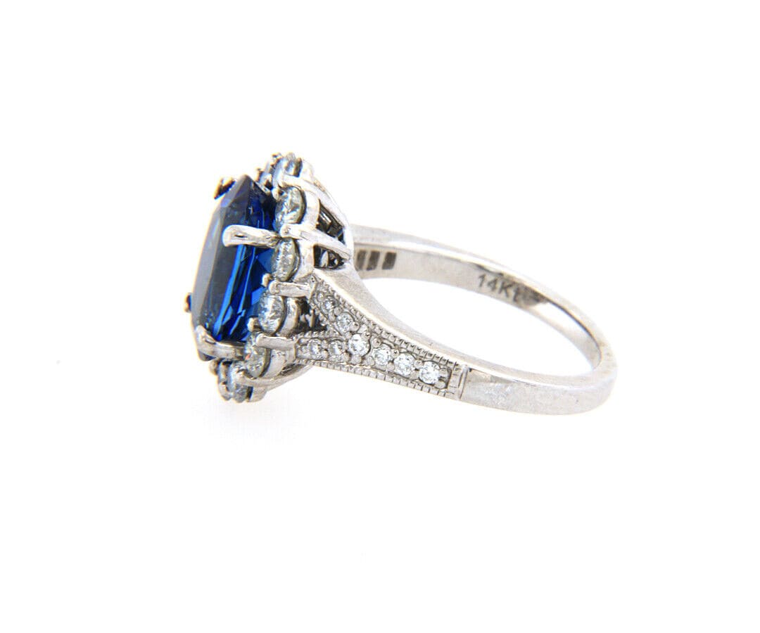 2.71ct Oval Tanzanite and 1.12ctw Diamond Frame Ring in 14K