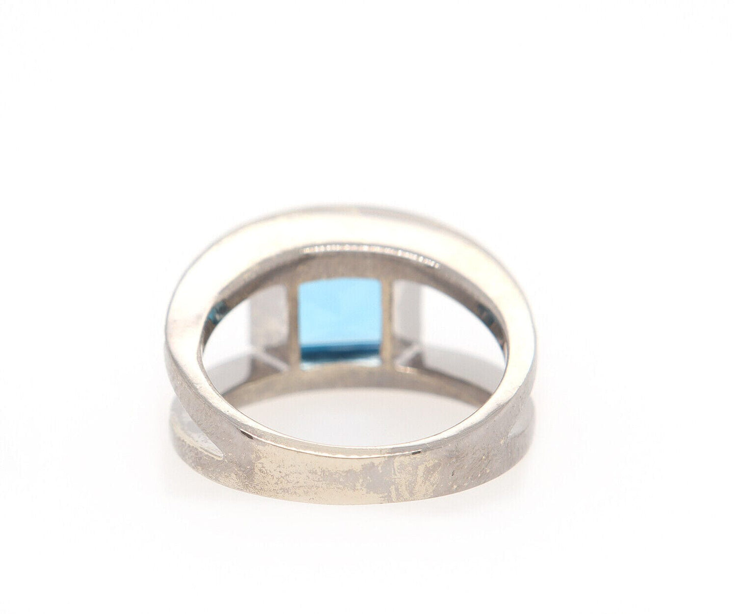 0.25ctw Diamond and Blue Topaz Bezel Set Ring in 14K