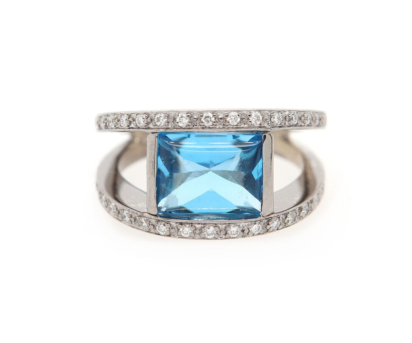 0.25ctw Diamond and Blue Topaz Bezel Set Ring in 14K