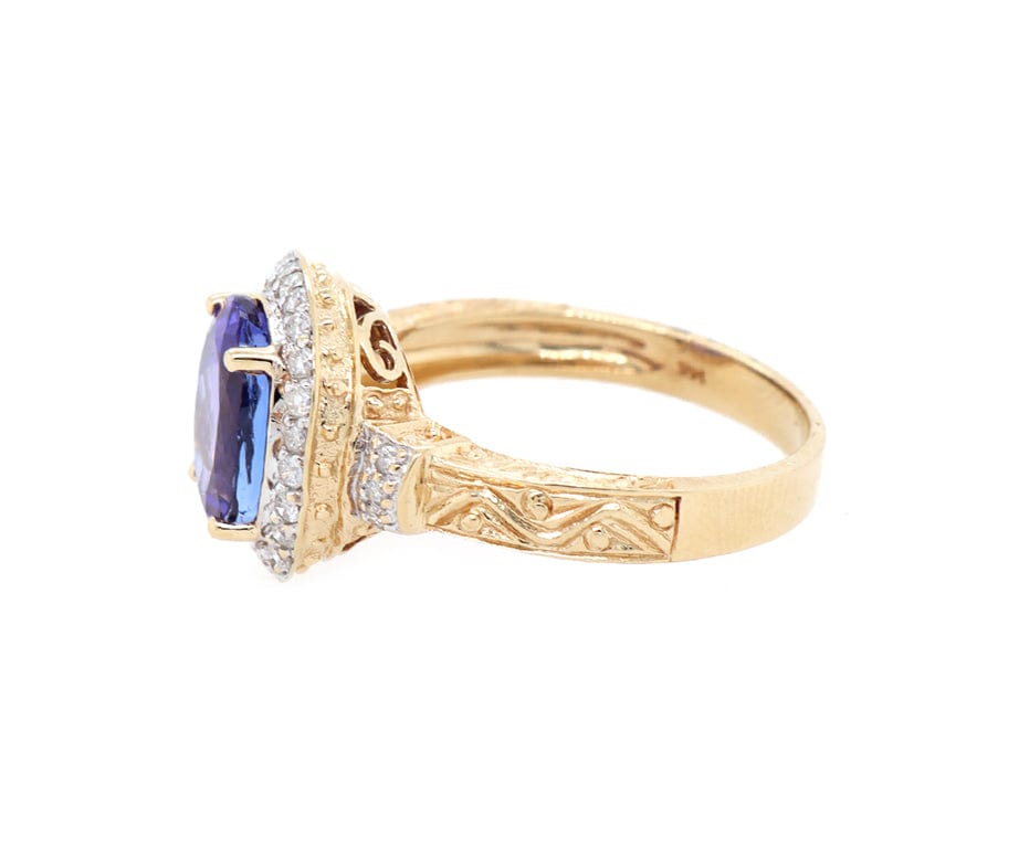 2.50ct Oval Tanzanite and 0.20ctw Diamond Frame Ring in 14K