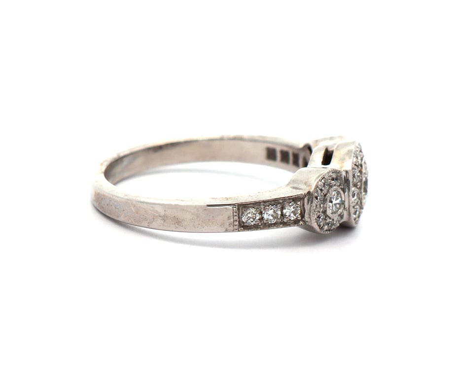 0.50ctw Round Diamond Three Stone Halo Ring in 14K