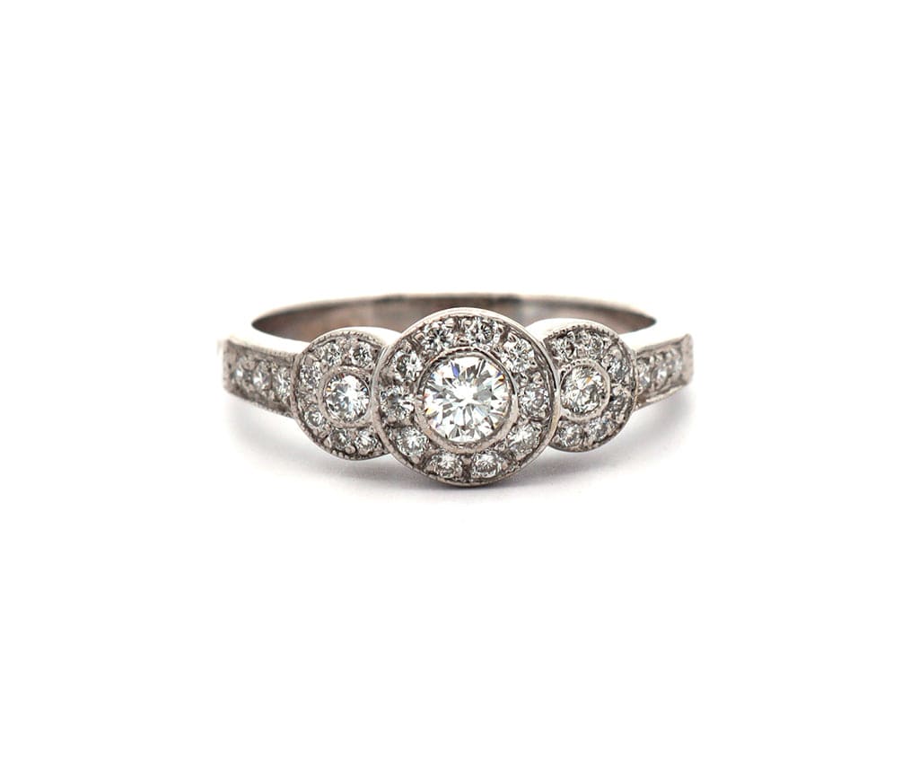 0.50ctw Round Diamond Three Stone Halo Ring in 14K