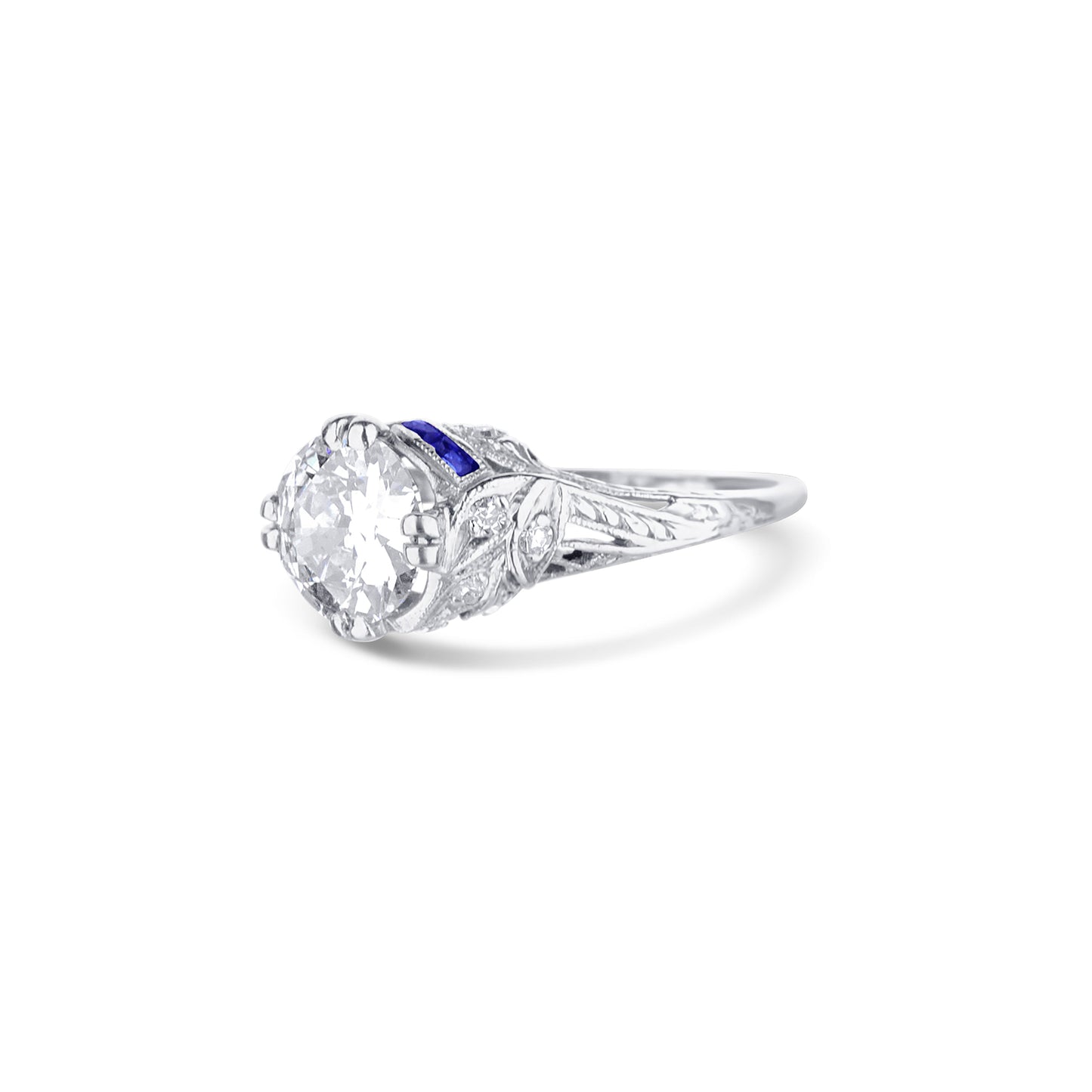 Art Deco Style Diamond Engagement Ring In Platinum With Blue Sapphire Detailing